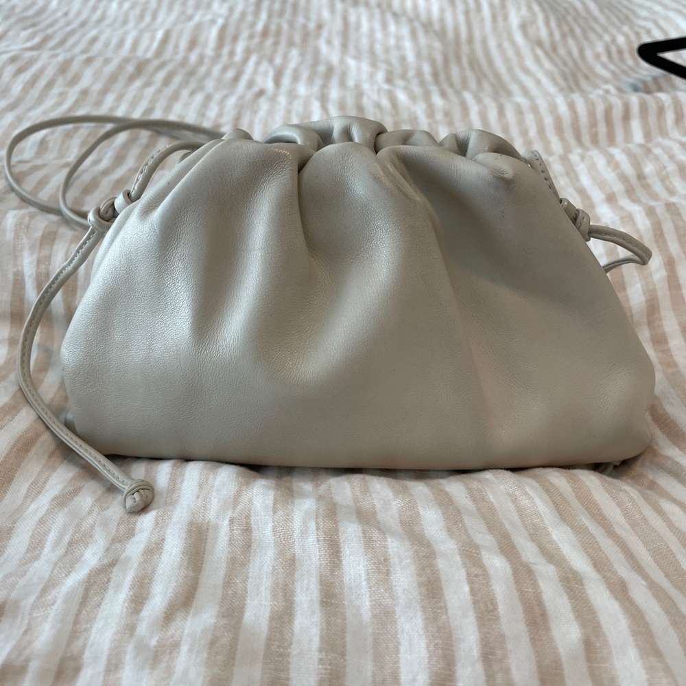 Bottega Veneta “The Mini Pouch Clutch” in off white